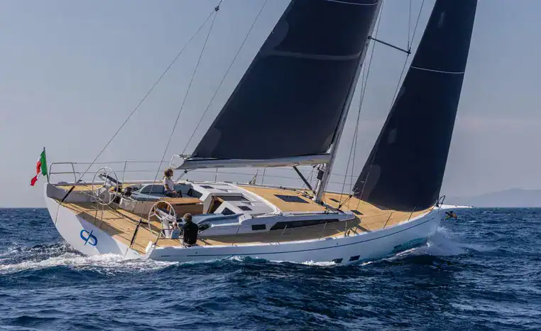 Luxury sailing yacht with black sails in Miami waters.