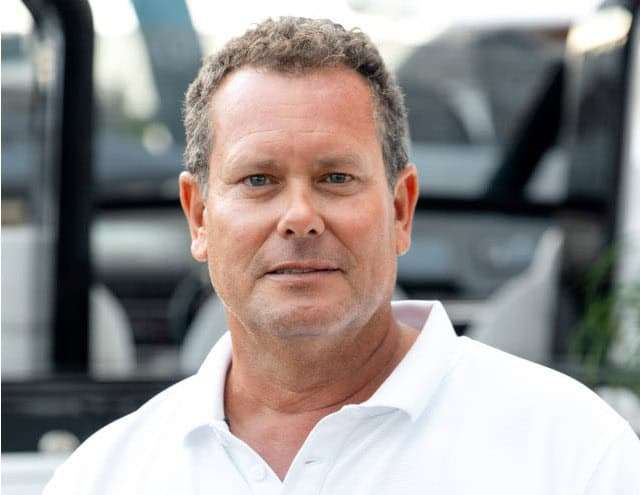 Man in white polo shirt at Pardo Yachts Miami event.