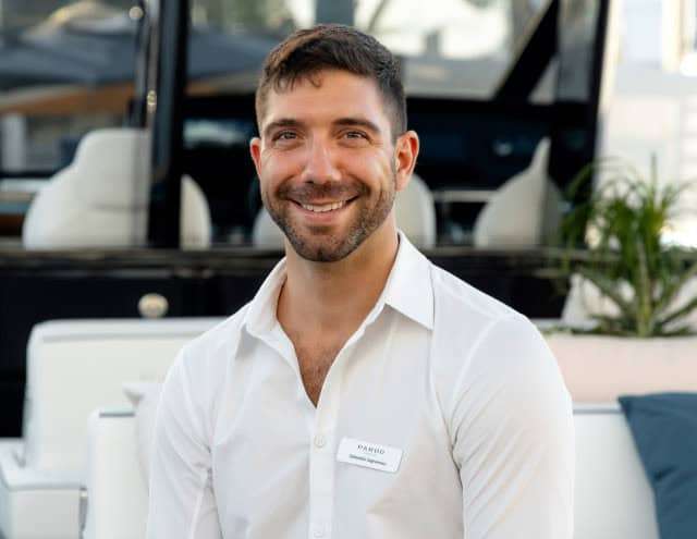 Smiling Pardo Yachts Miami staff member in showroom.